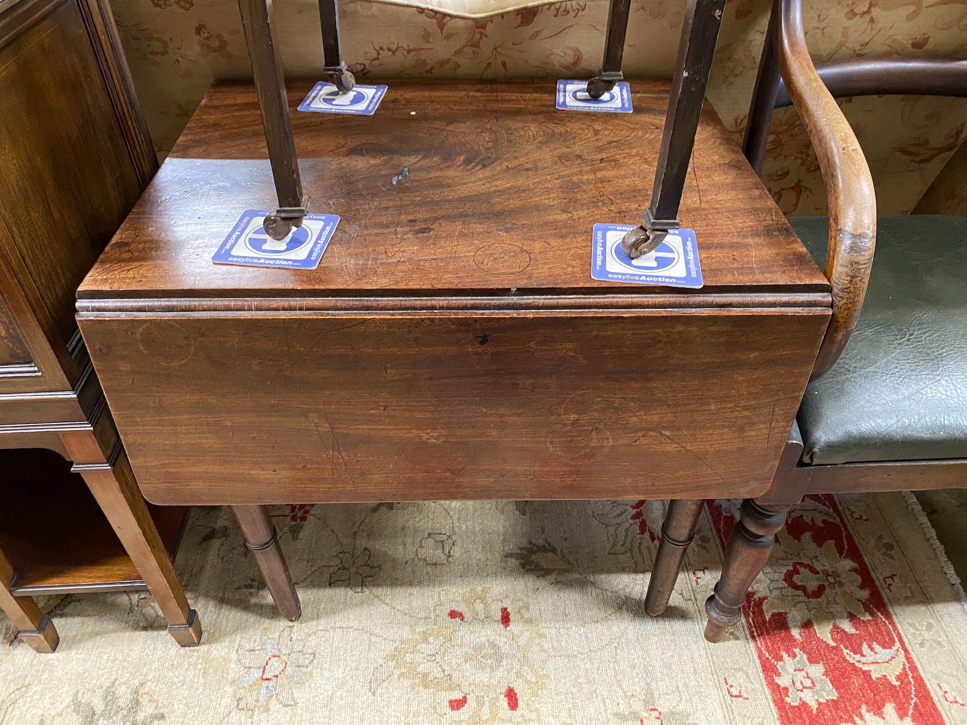 An early Victorian provincial mahogany elbow chair, and Edwardian drop flap table and a Provincial Pembroke table (cut down)